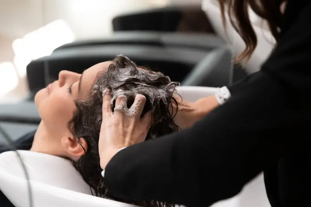 Fingertip scalp massage during scalp cleaning at home
